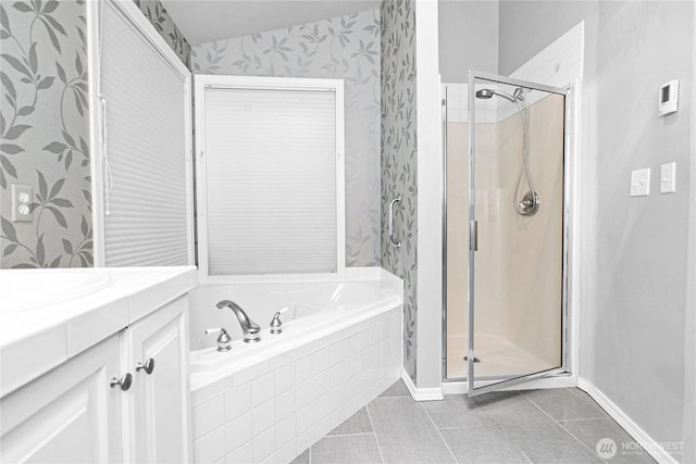 2222 60th Ln NW, Olympia, WA 98502 - bathroom with tile patterned flooring, wallpapered walls, a stall shower, a garden tub, and baseboards
