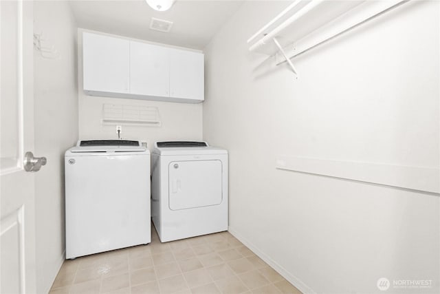 2222 60th Ln NW, Olympia, WA 98502 - clothes washing area with independent washer and dryer, cabinet space, and baseboards