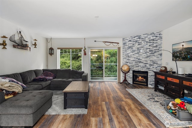 living area featuring wood finished floors and a tile fireplace
