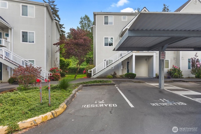 partially covered parking lot featuring stairs