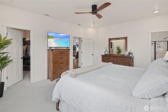 12713 176th Ave E, Bonney Lake, WA 98391 - bedroom with a walk in closet, light carpet, a closet, a ceiling fan, and recessed lighting