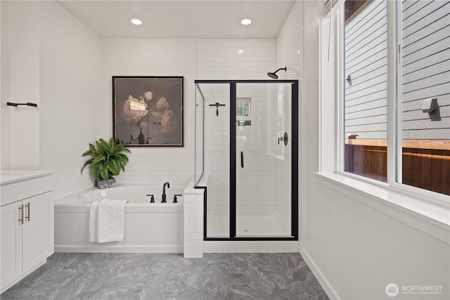 12713 176th Ave E, Bonney Lake, WA 98391 - bathroom with a garden tub, a stall shower, vanity, marble finish flooring, and recessed lighting