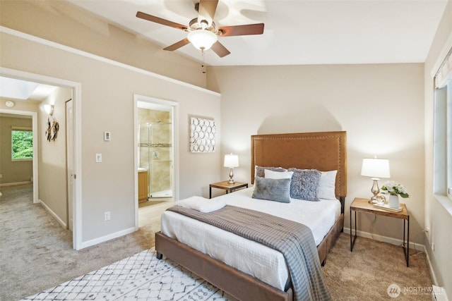 13015 102nd Ln NE Unit 2, Kirkland, WA 98034 - bedroom featuring light colored carpet, vaulted ceiling, baseboards, connected bathroom, and ceiling fan