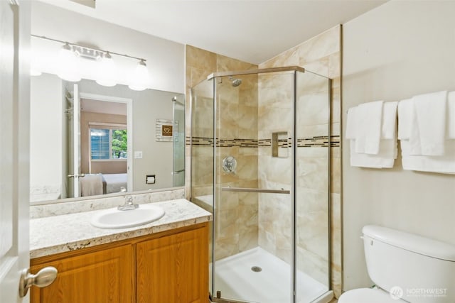 13015 102nd Ln NE Unit 2, Kirkland, WA 98034 - full bathroom with connected bathroom, a stall shower, vanity, and toilet