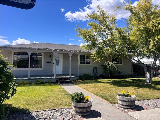 235 Ivy St NE, Ephrata, WA 98823 - view of front of house featuring a porch and a front yard