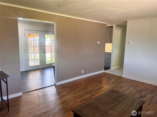 235 Ivy St NE, Ephrata, WA 98823 - spare room with dark wood finished floors, baseboards, french doors, and crown molding