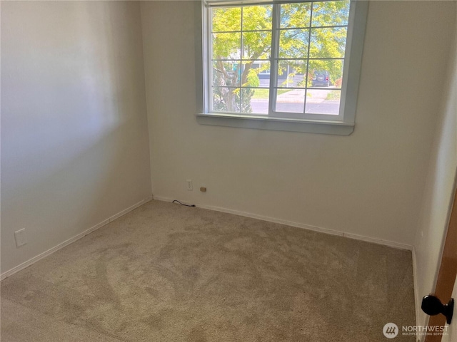 235 Ivy St NE, Ephrata, WA 98823 - spare room featuring carpet and baseboards