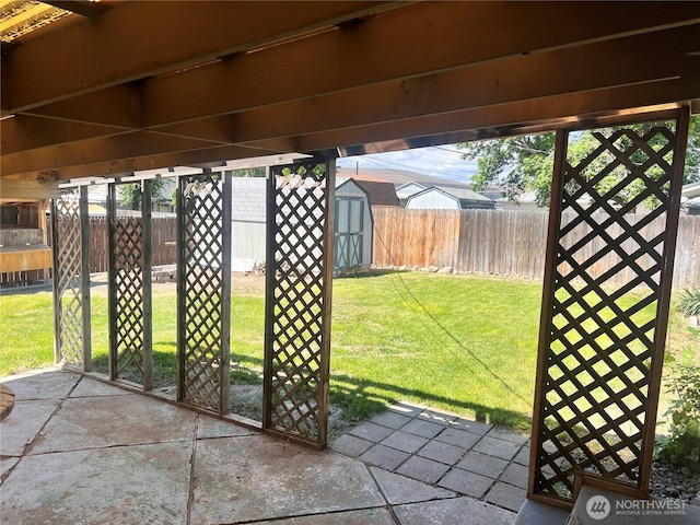 235 Ivy St NE, Ephrata, WA 98823 - view of patio featuring a shed and an outbuilding