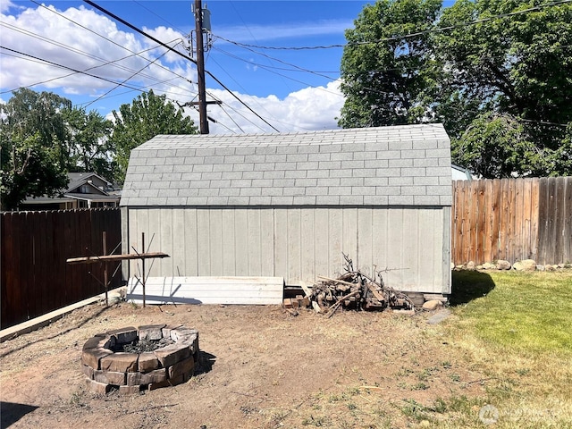 235 Ivy St NE, Ephrata, WA 98823 - view of shed with an outdoor fire pit