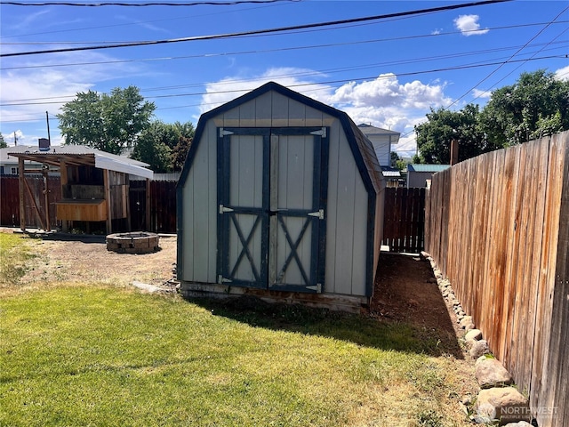 235 Ivy St NE, Ephrata, WA 98823 - view of shed featuring an outdoor fire pit