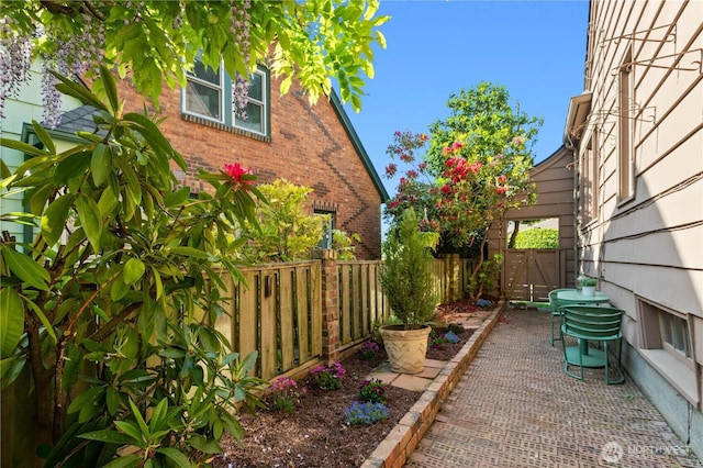 view of yard with fence and a gate