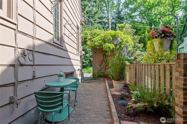 view of yard with fence and a patio