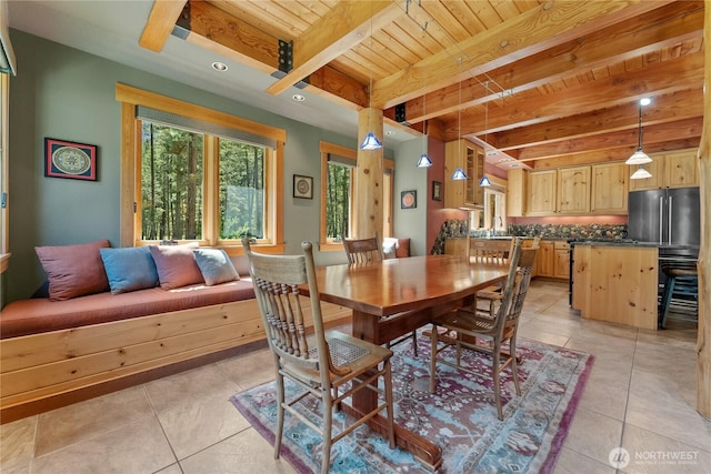dining room featuring wood ceiling, light tile patterned floors, and beam ceiling