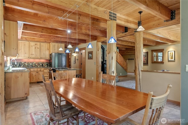 dining space with stairs, light tile patterned floors, beam ceiling, wooden ceiling, and baseboards