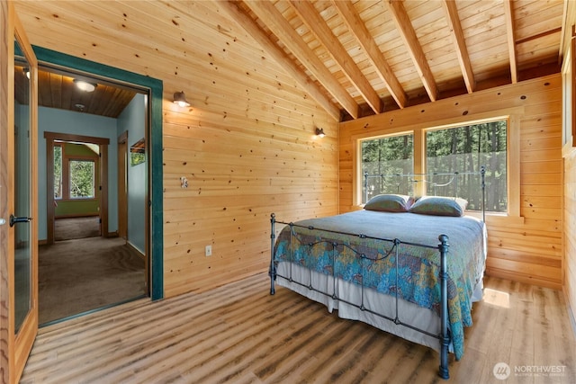 bedroom with wood ceiling, wood walls, and wood finished floors