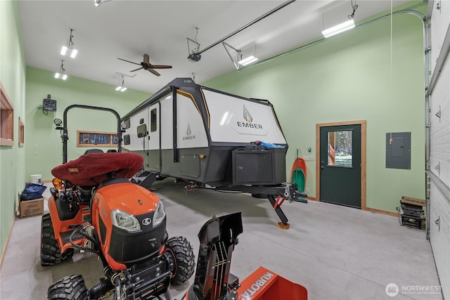 garage featuring electric panel and ceiling fan