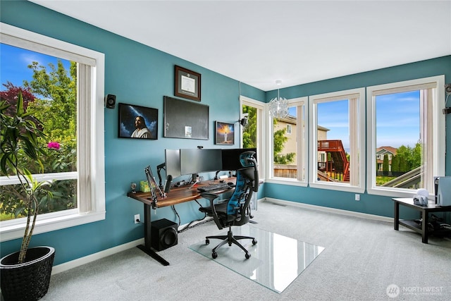 carpeted office space with baseboards