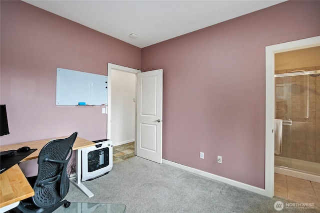 carpeted office featuring heating unit and baseboards