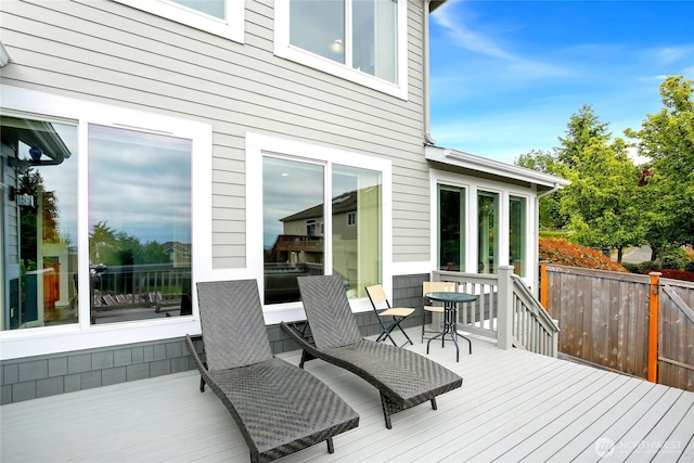 wooden deck featuring fence