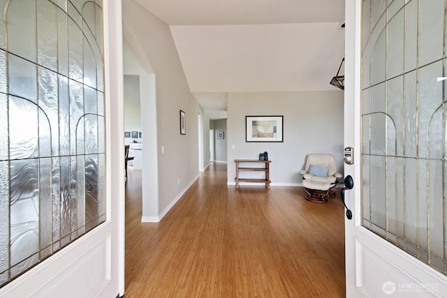 4638 Tanner View Dr, Clinton, WA 98236 - foyer entrance featuring wood finished floors, baseboards, and arched walkways