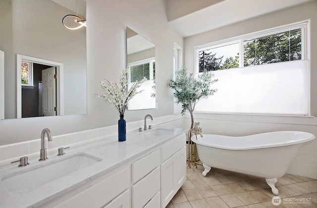 4638 Tanner View Dr, Clinton, WA 98236 - full bathroom featuring tile patterned flooring, plenty of natural light, a soaking tub, and double vanity