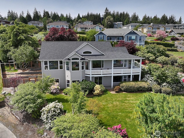 4638 Tanner View Dr, Clinton, WA 98236 - rear view of property featuring a shingled roof, a residential view, a balcony, and view of wooded area
