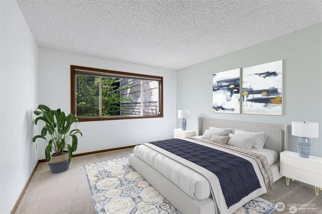12840 SE 40th Ct Unit B2, Bellevue, WA 98006 - bedroom with carpet floors, a textured ceiling, and baseboards