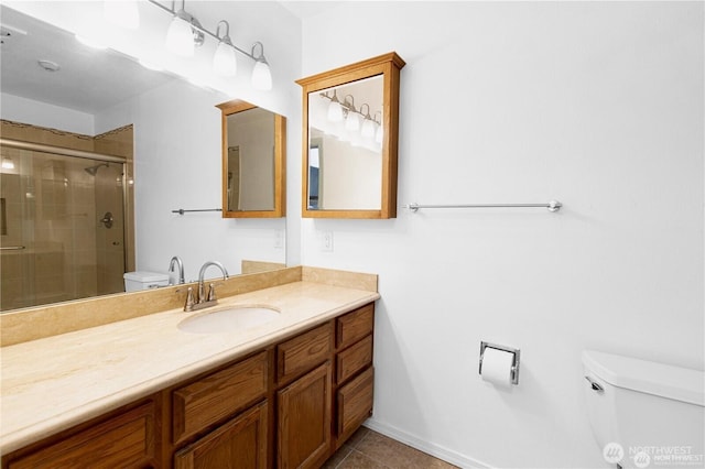 12840 SE 40th Ct Unit B2, Bellevue, WA 98006 - bathroom featuring toilet, vanity, a stall shower, tile patterned floors, and baseboards