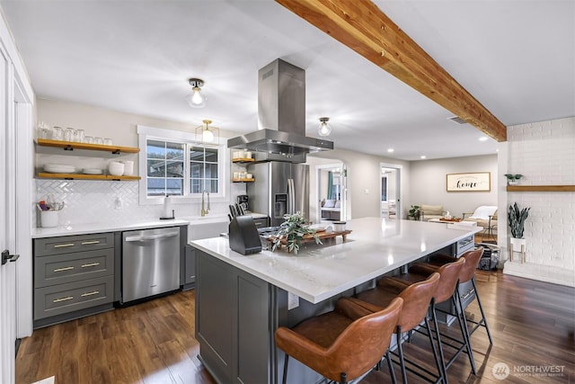 321 Park Pl, Lynden, WA 98264 - kitchen featuring island exhaust hood, stainless steel appliances, open shelves, dark wood finished floors, and beam ceiling