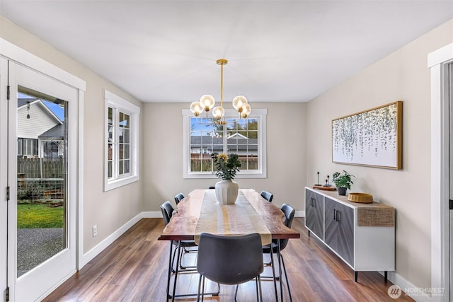 321 Park Pl, Lynden, WA 98264 - dining room with a chandelier, baseboards, and dark wood finished floors