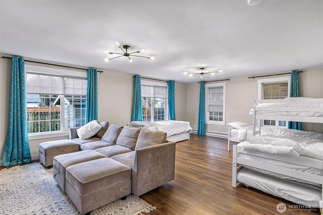 321 Park Pl, Lynden, WA 98264 - living room featuring healthy amount of natural light, wood finished floors, and a chandelier