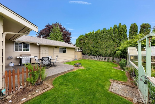 321 Park Pl, Lynden, WA 98264 - view of yard featuring a patio, an outdoor fire pit, and an exterior structure