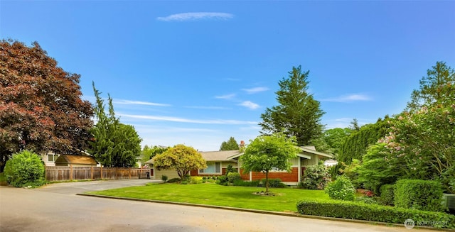 321 Park Pl, Lynden, WA 98264 - view of property hidden behind natural elements with concrete driveway