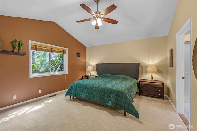 carpeted bedroom with lofted ceiling, baseboards, and a ceiling fan