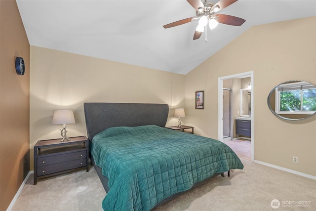 carpeted bedroom with baseboards, vaulted ceiling, a ceiling fan, and connected bathroom