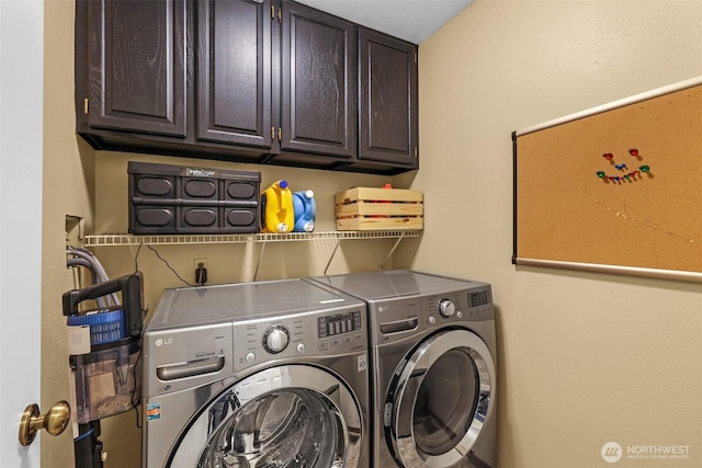 laundry area with cabinet space and separate washer and dryer