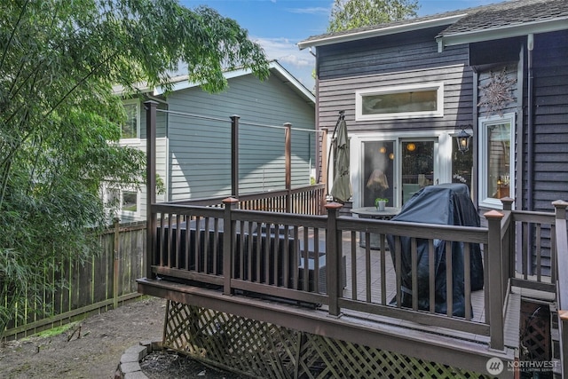wooden deck featuring fence