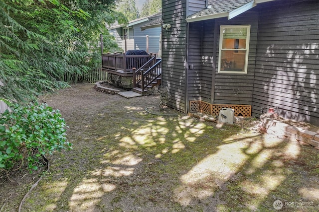 view of yard featuring a wooden deck