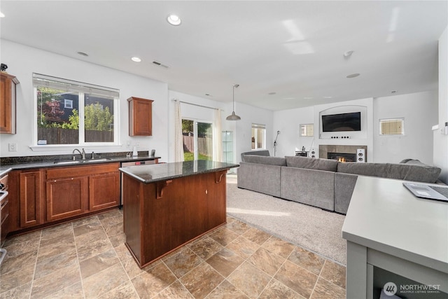 1339 E 51st St, Tacoma, WA 98404 - kitchen featuring a sink, open floor plan, a center island, a fireplace, and recessed lighting