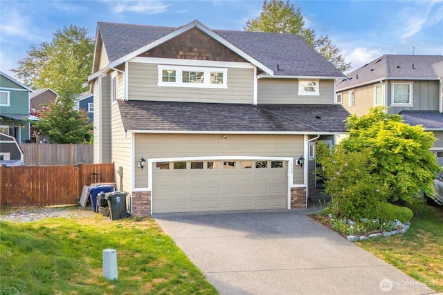 1339 E 51st St, Tacoma, WA 98404 - view of front of property featuring an attached garage, roof with shingles, concrete driveway, and stone siding