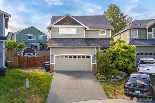 1339 E 51st St, Tacoma, WA 98404 - view of front of house with an attached garage, concrete driveway, roof with shingles, and stone siding