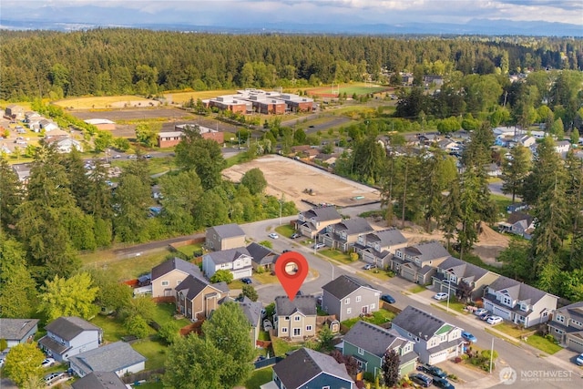 1339 E 51st St, Tacoma, WA 98404 - aerial view of property and surrounding area with nearby suburban area and a heavily wooded area