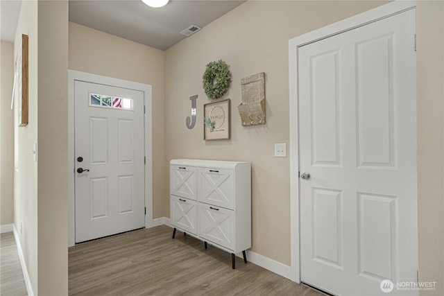 3677 SE Chesterton Dr, Port Orchard, WA 98366 - foyer with baseboards and light wood-type flooring
