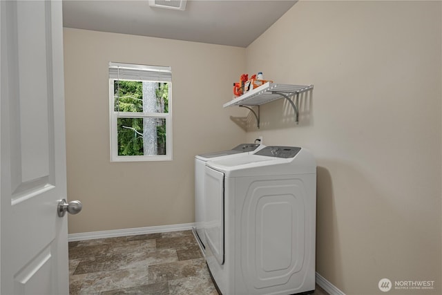 3677 SE Chesterton Dr, Port Orchard, WA 98366 - washroom featuring washing machine and dryer, baseboards, and stone finish flooring