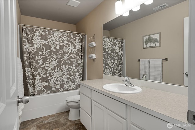 3677 SE Chesterton Dr, Port Orchard, WA 98366 - full bathroom featuring toilet, vanity, shower / bath combo, and stone finish flooring