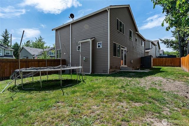 3677 SE Chesterton Dr, Port Orchard, WA 98366 - rear view of house with a trampoline and entry steps