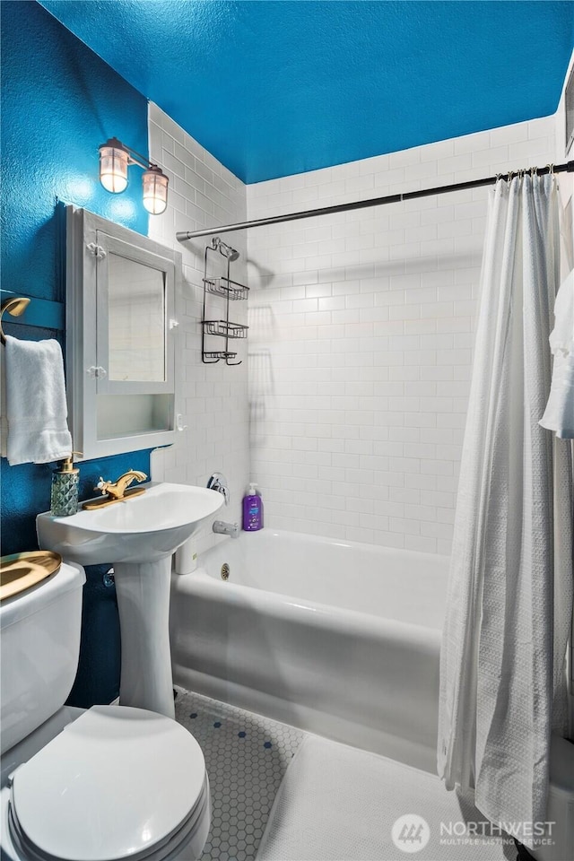 905 NE 43rd Ave Unit 110, Seattle, WA 98105 - full bath featuring toilet, shower / bath combo, and tile patterned floors