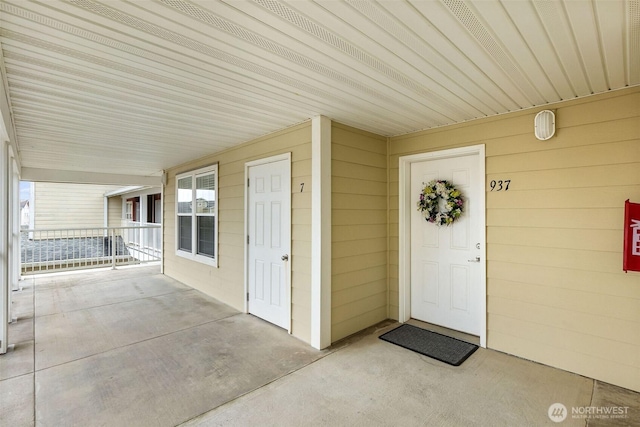 doorway to property featuring a porch