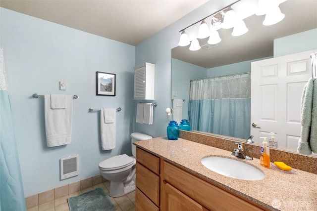full bath with tile patterned floors, vanity, toilet, heating unit, and curtained shower
