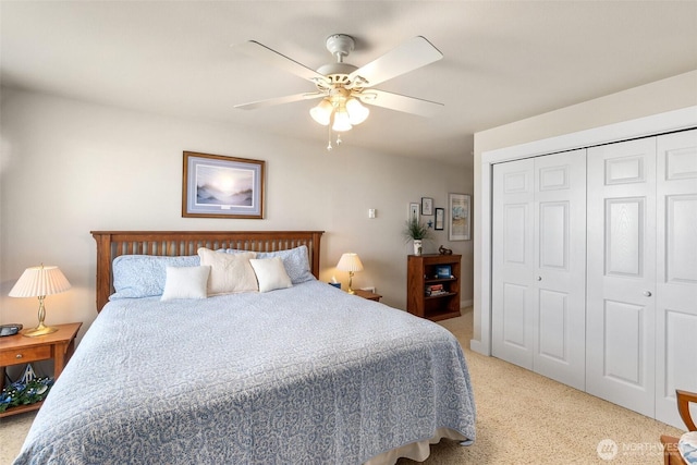 bedroom featuring light carpet, a closet, and ceiling fan